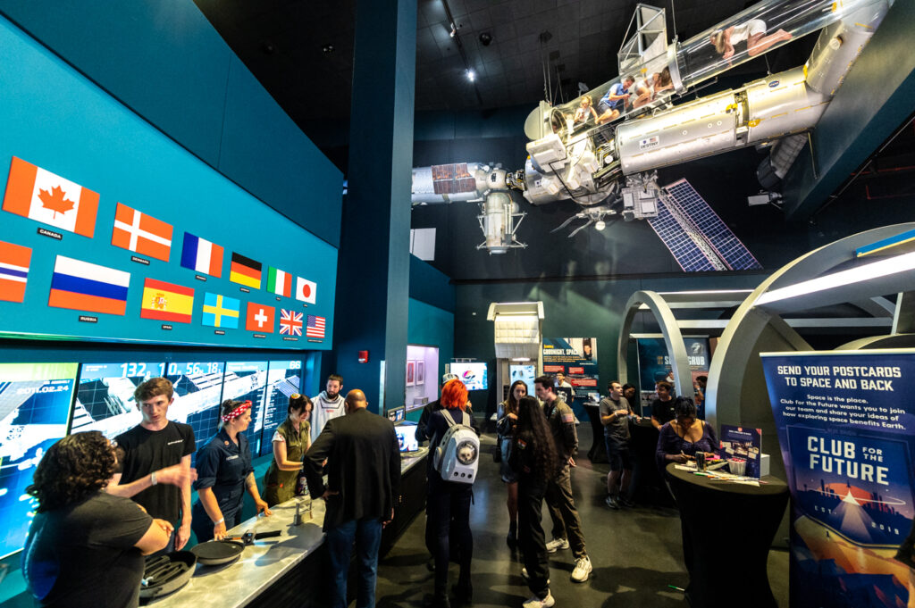 Exhibits at Yuri's Night underneath a mock International Space Station at The Kennedy Space Center's Visitor's Center Complex.