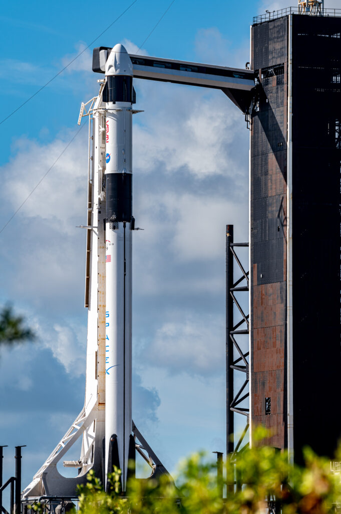 Viewed from the north Falcon 9 stands tall at the pad.