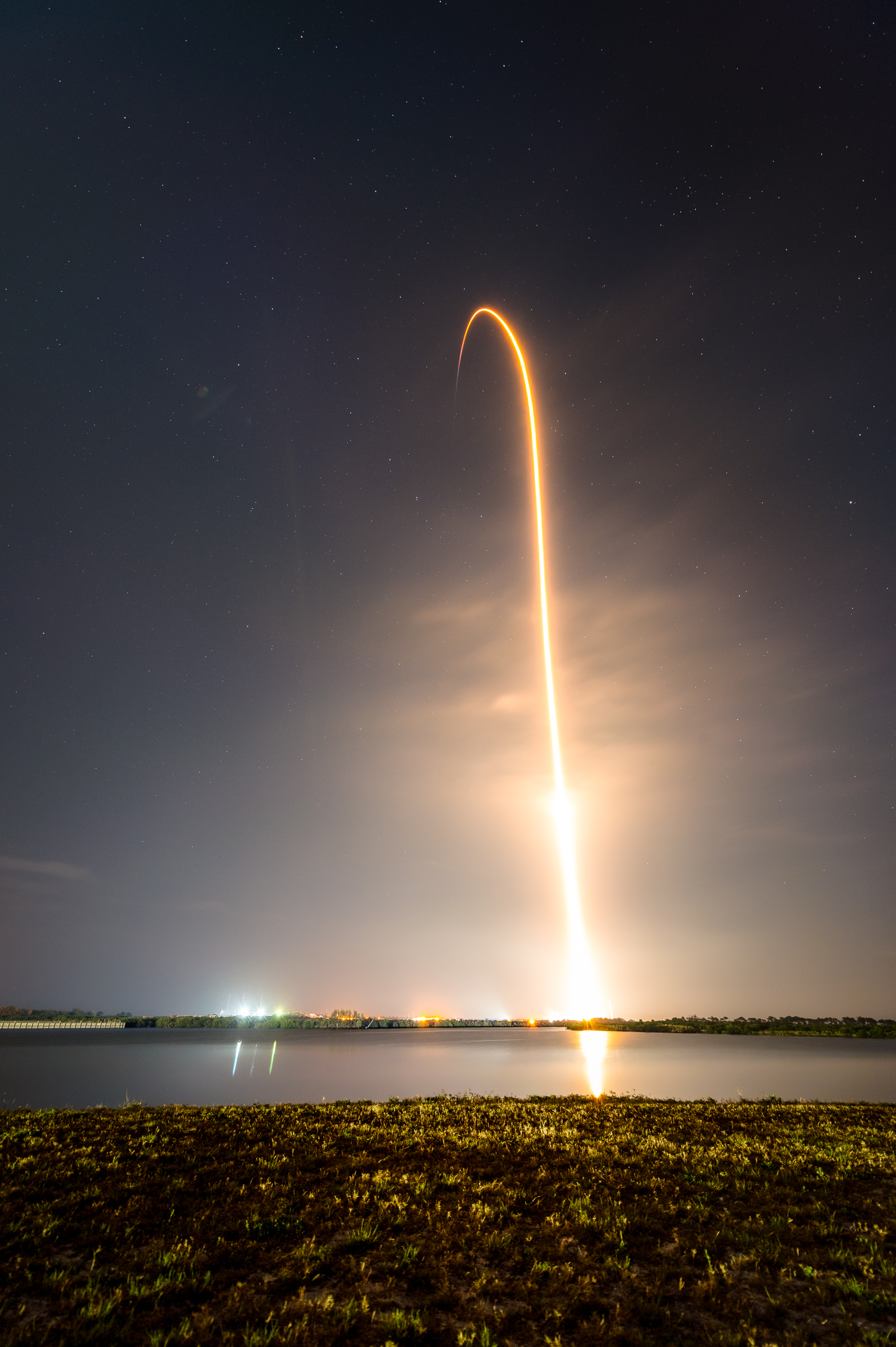 A long exposure of Falcon 9 and Crew Dragon lifting off from LC-39A. As seen from the Press Site lawn.