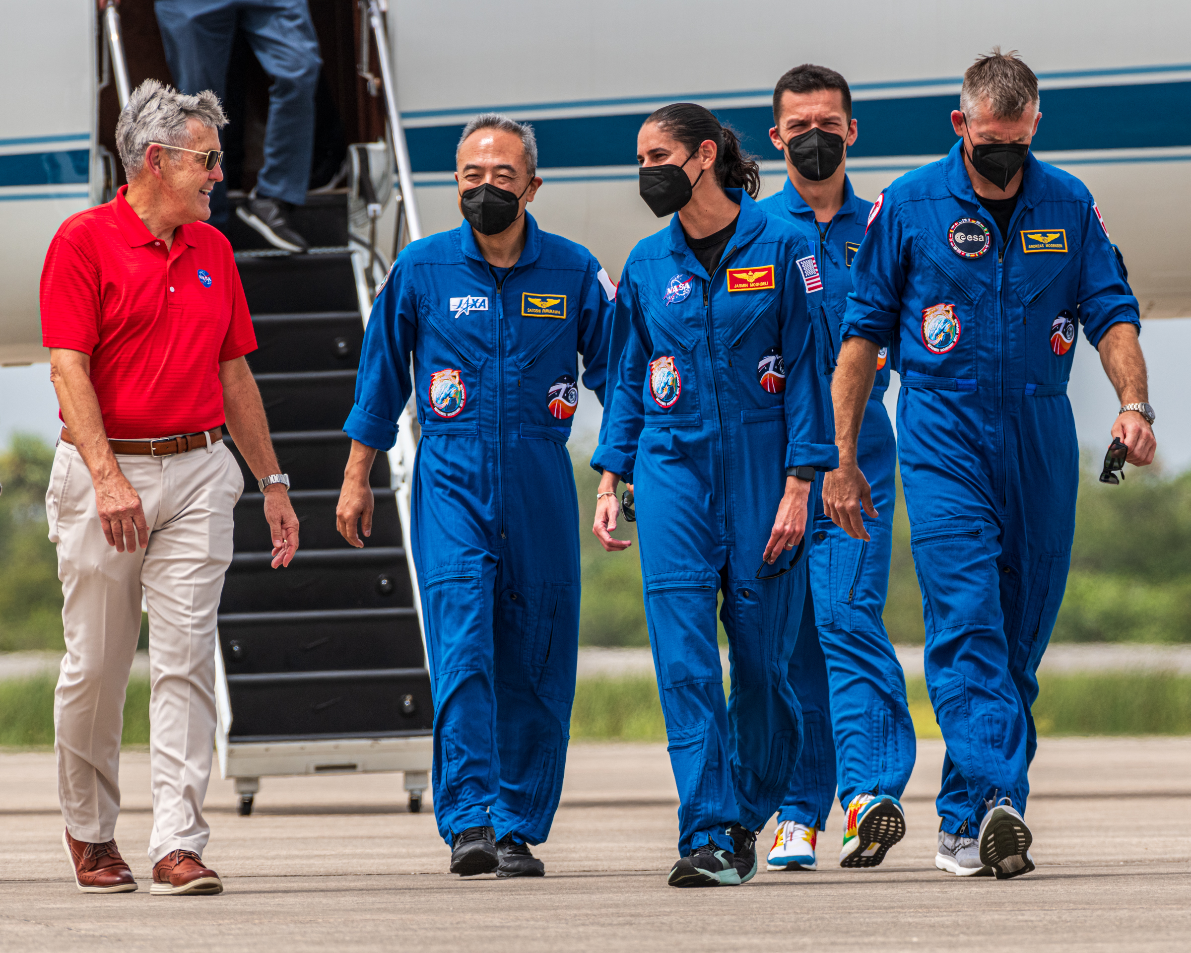 Bob Cabana, Associate Administrator NASA, and Crew-7 walking towards the press conference after the crew just arrived in Florida.