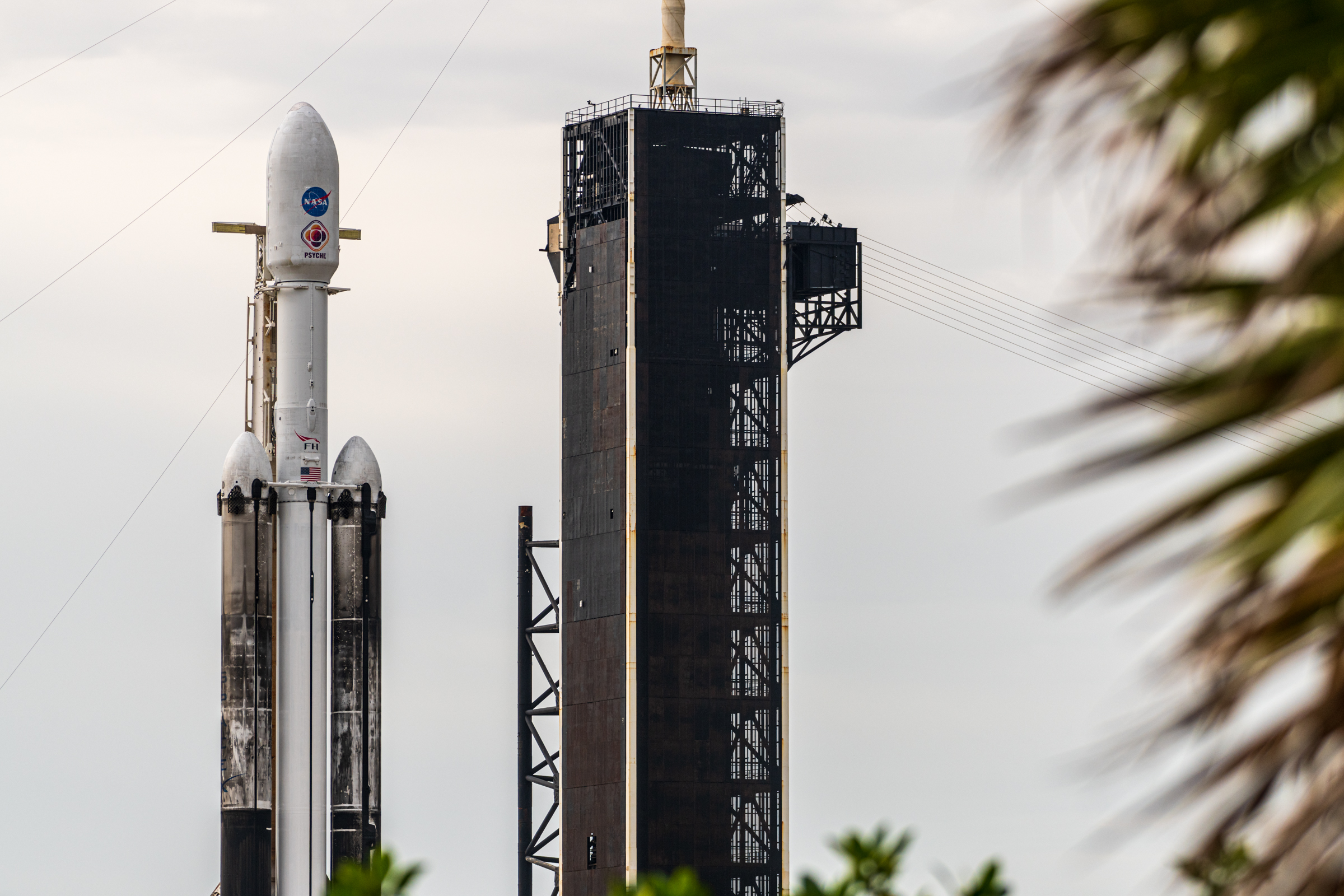 A static image of Falcon Heavy on the pad during remote camera setup. As seen from along Cape Rd.